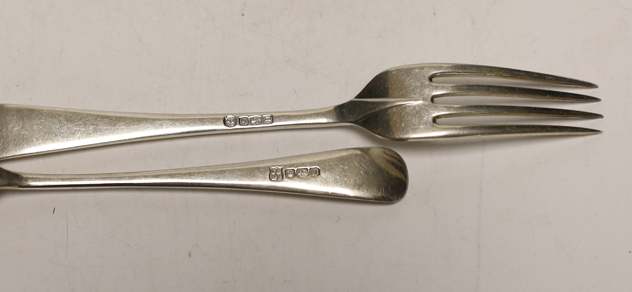 A set of six George VI silver rat tail pattern soup spoons, Cooper Brothers s & Sons, Sheffield, 1937 and six assorted silver dessert forks, 20.3oz.